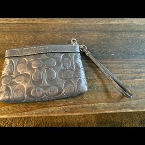 Coach wristlet with purple satin liner